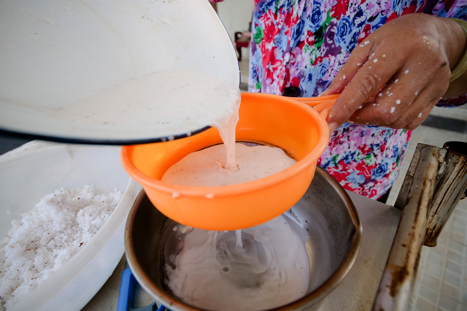 Strain out the coconut meat fibers from your coconut cream