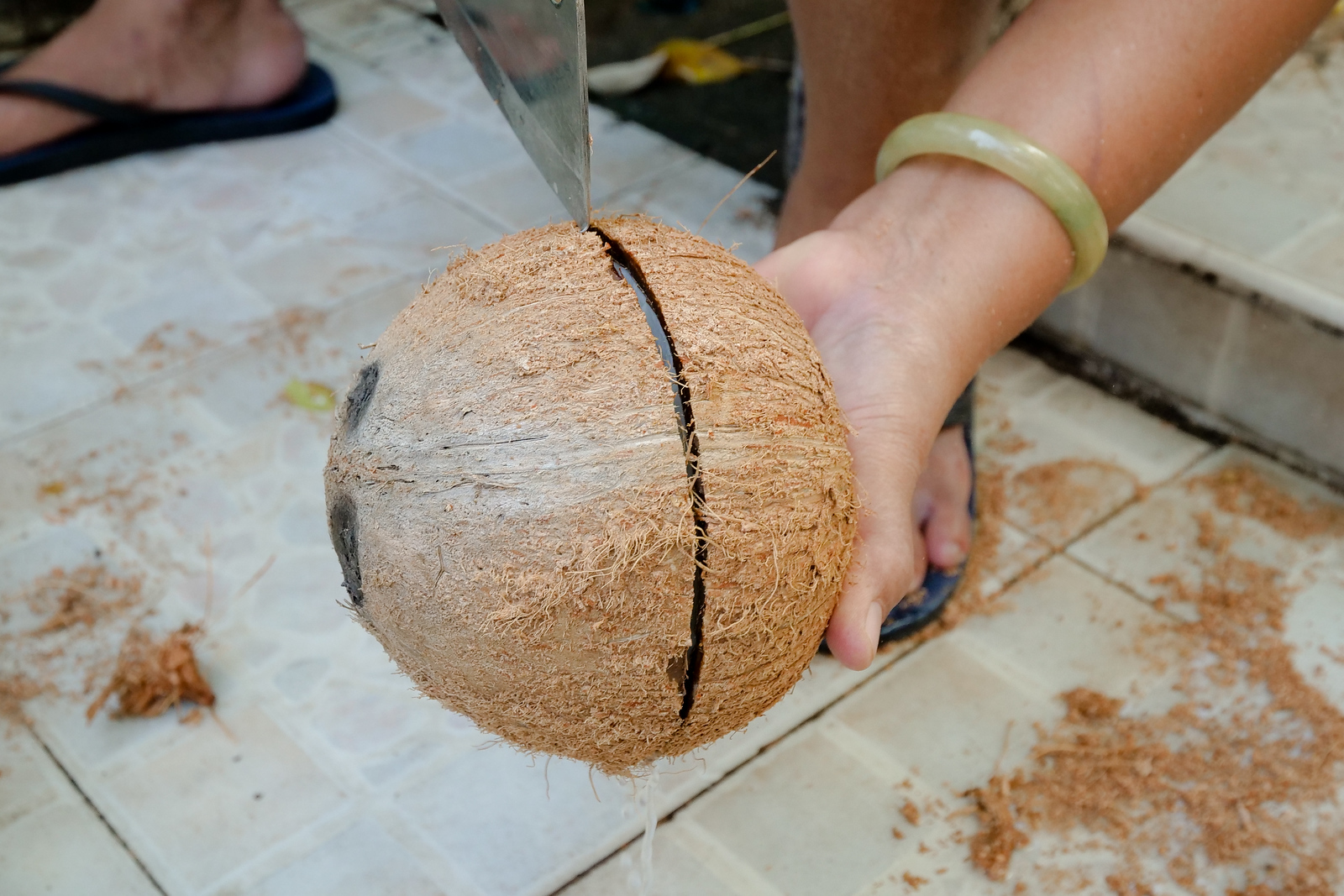 Coconut water running out of the shell