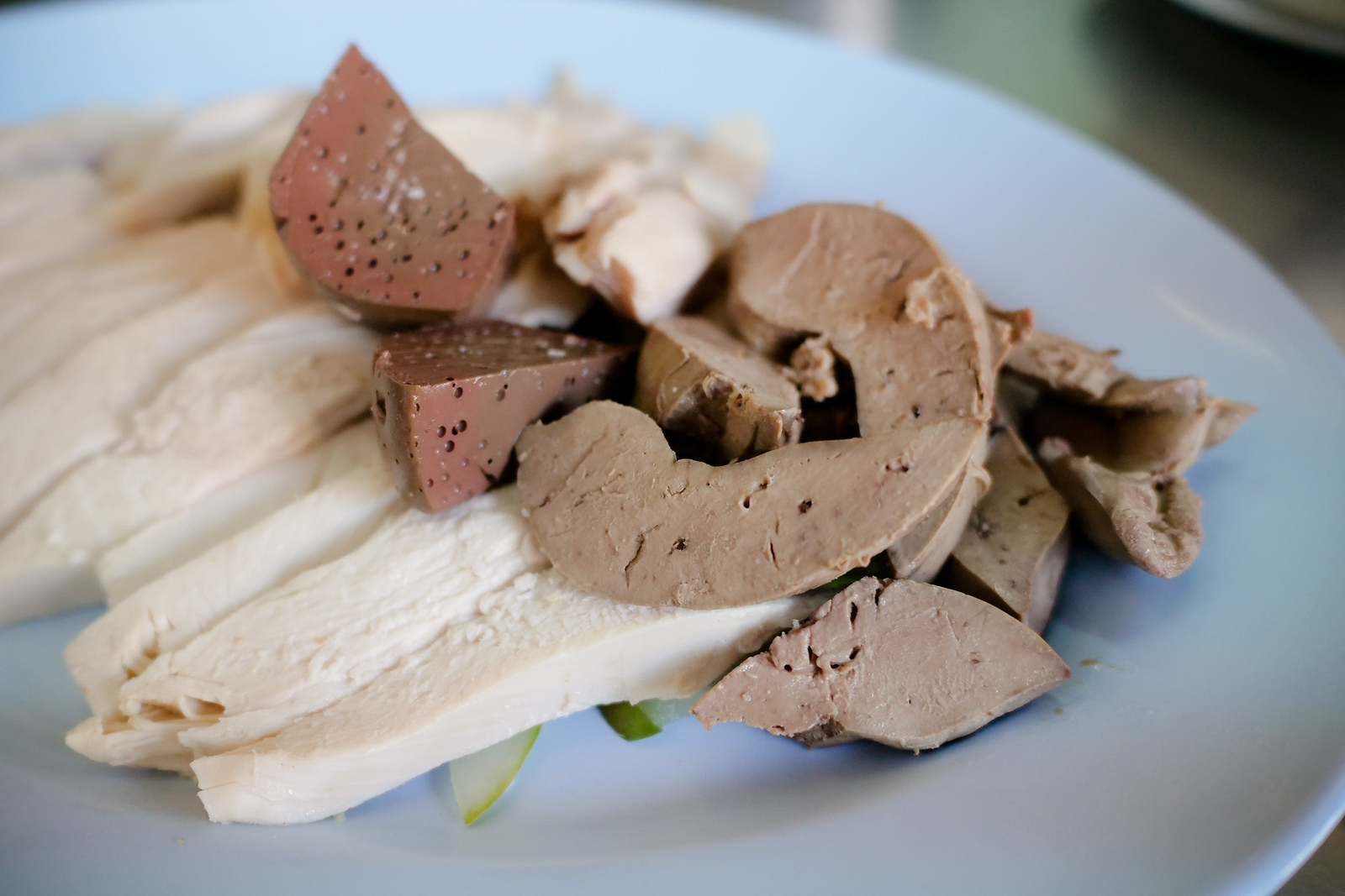 Three types of meat on each plate of Chicken Rice